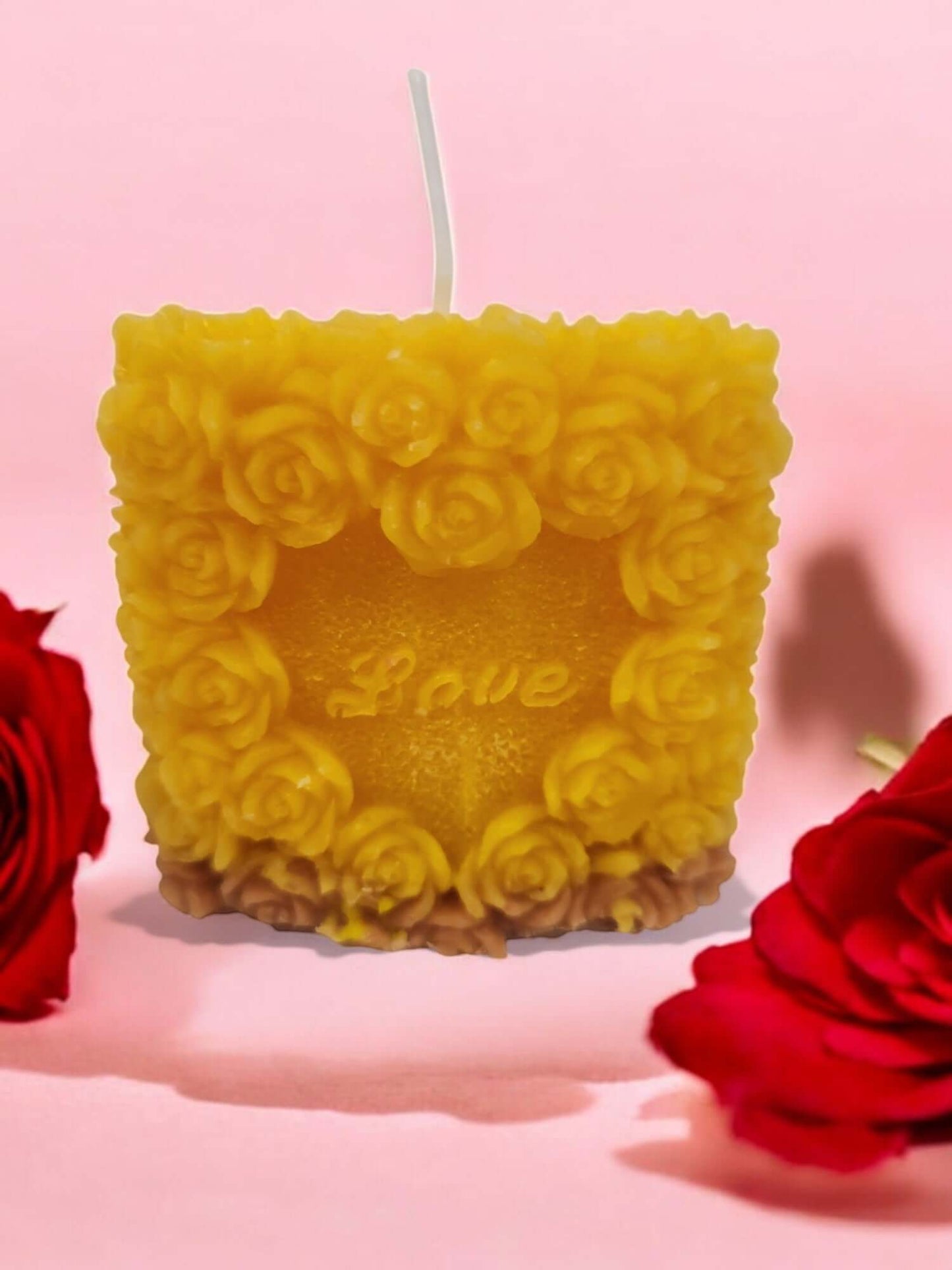 Sensual drip and massage candle designed for intimacy, featuring a rose motif and warm, skin-safe wax.