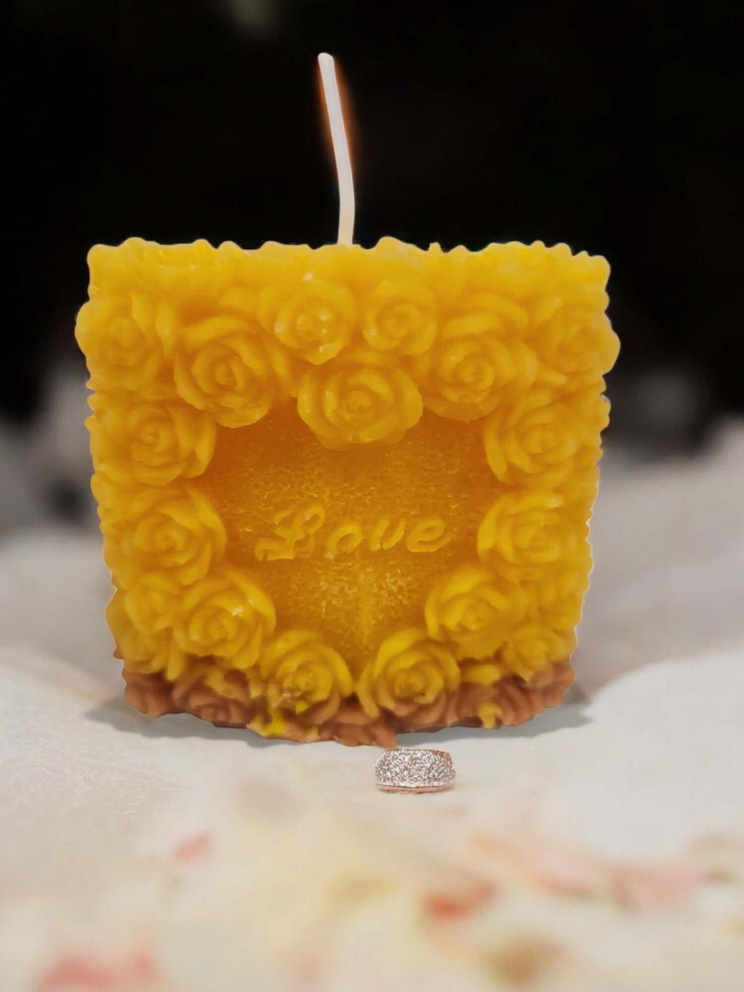 Love Rose sensual massage candle with floral design, perfect for intimate moments and erotic play.