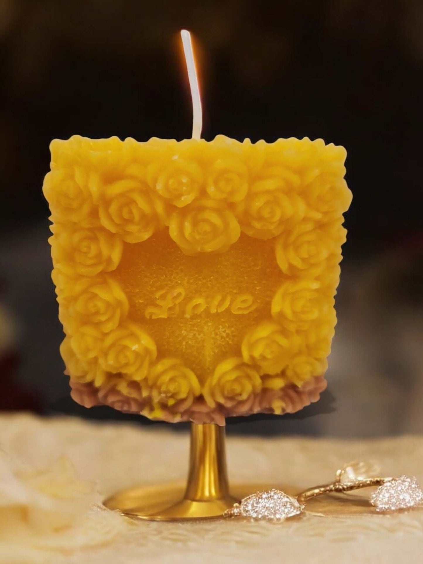 Love Rose sensual massage candle with floral design, perfect for intimate moments and erotic play.