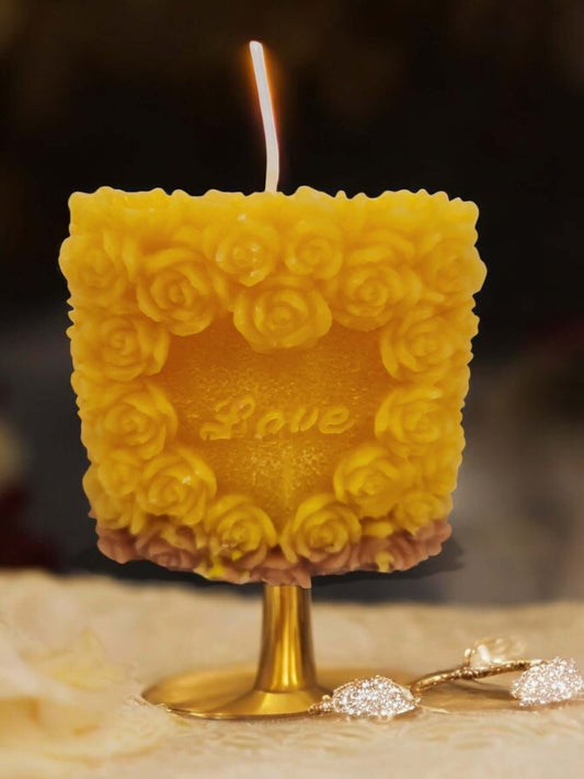 Love Rose sensual massage candle with floral design, perfect for intimate moments and erotic play.