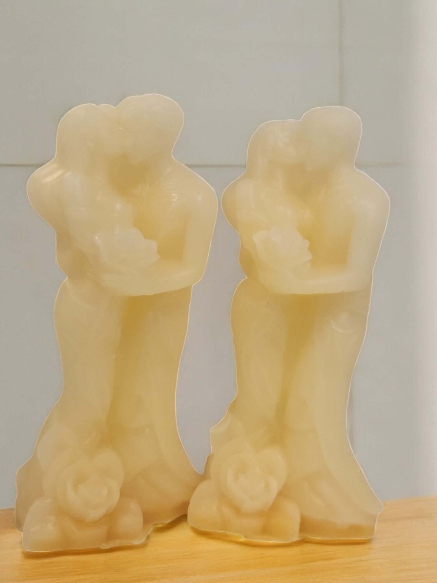 Elegant couple candle sculptures symbolizing intimacy and romance, ideal for enhancing sensual experiences.