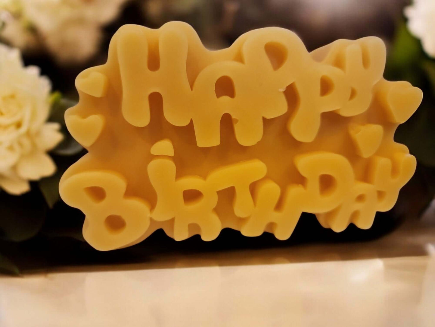 Happy Birthday candle in a festive design, ideal for birthday celebrations and special occasions.