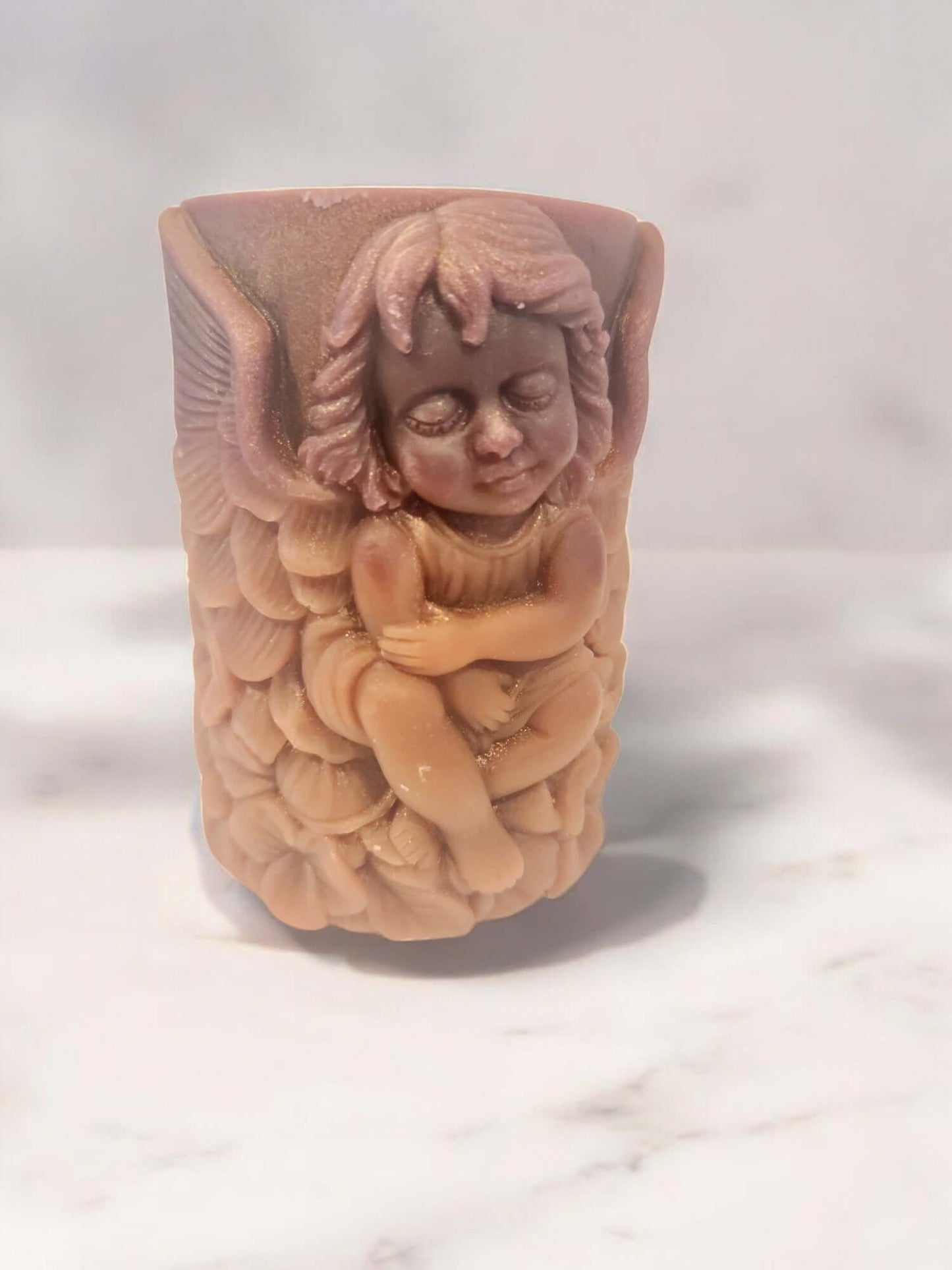 Angel Wing massage candle with angel figure, ideal for sensual play and relaxation.