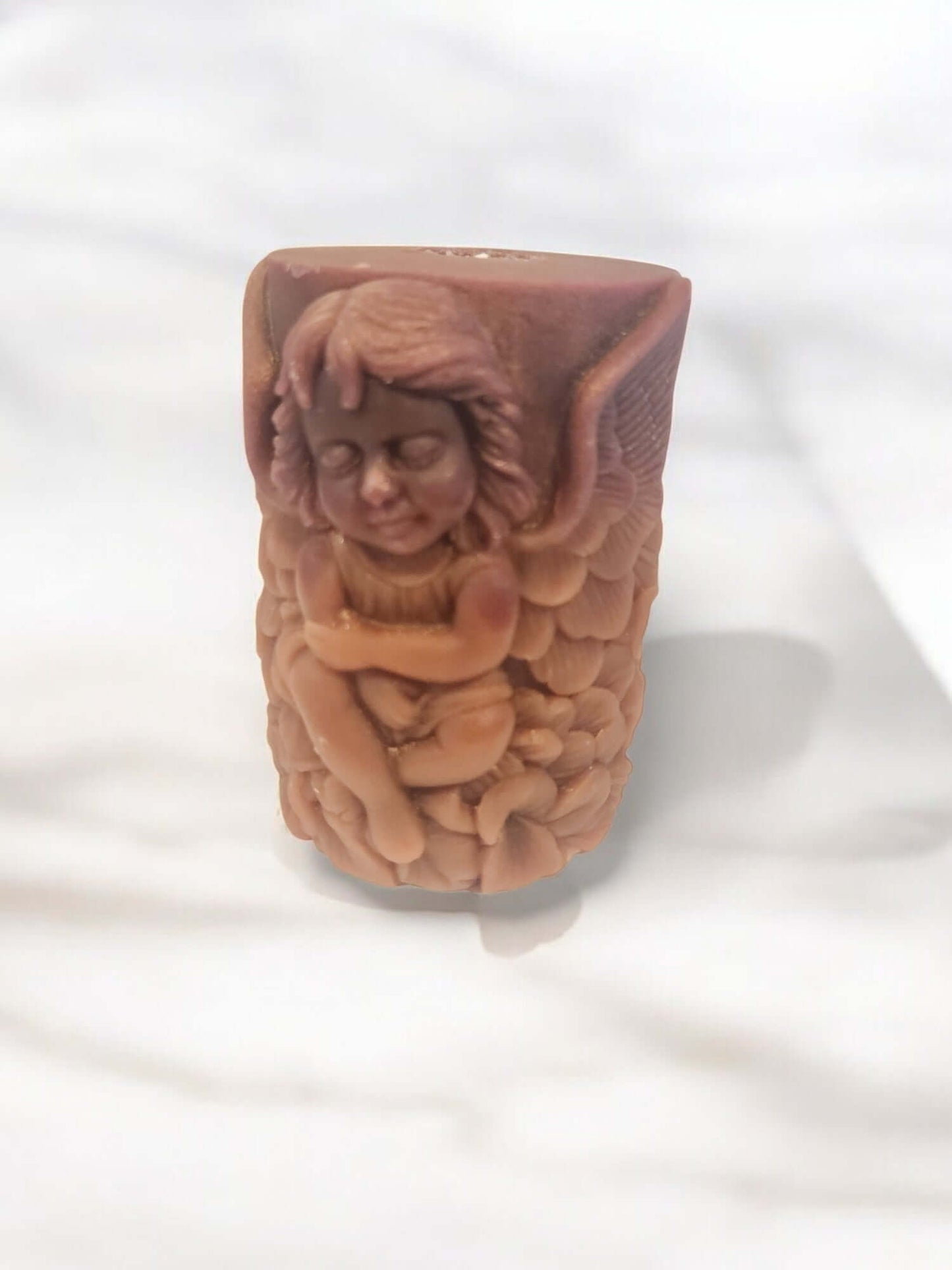 Angel Wing massage candle featuring a sculpted cherub design, perfect for intimate moments and sensual relaxation.