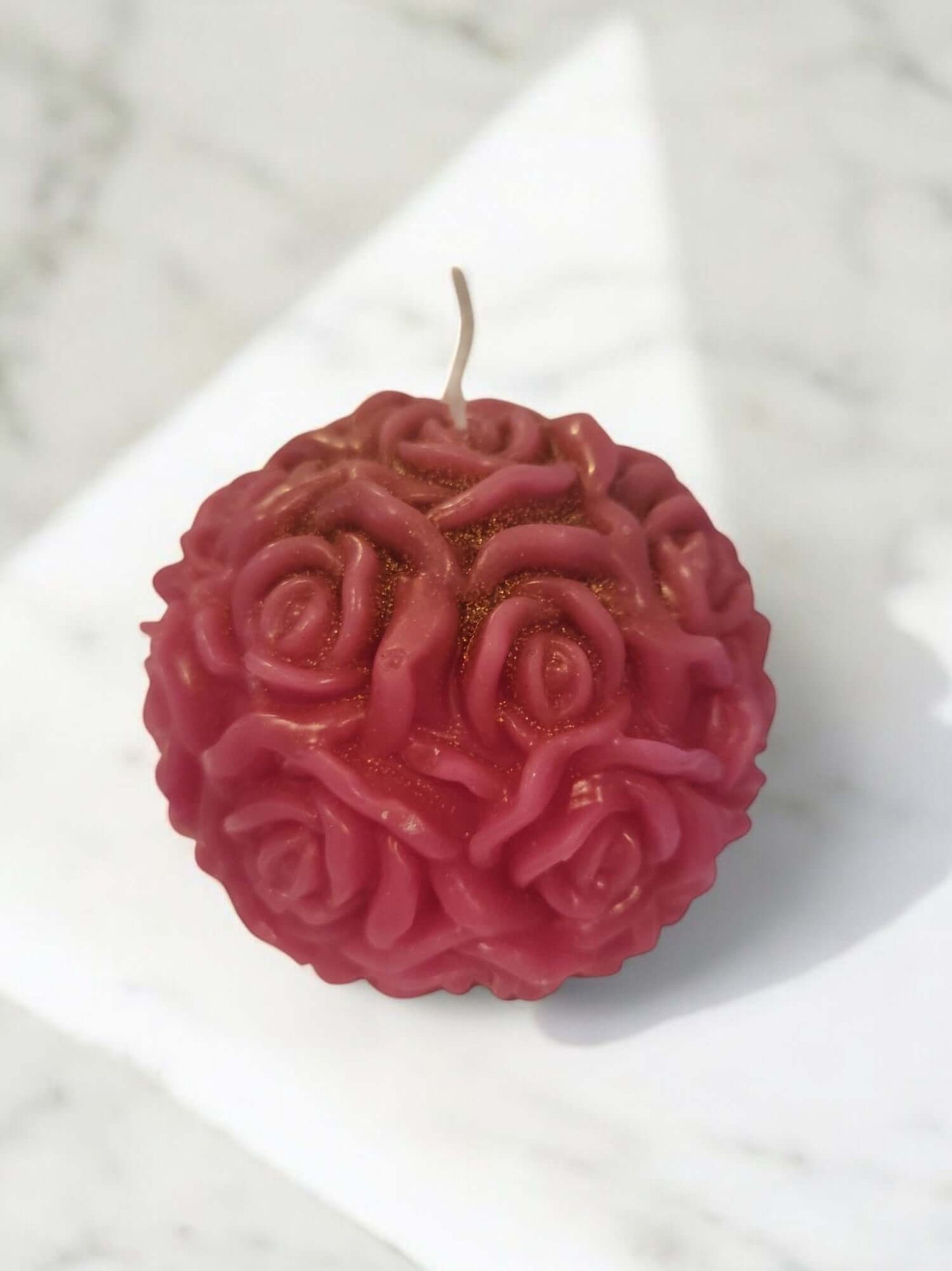Rose ball massage candle, designed for sensual and erotic play, with low-temperature wax for a warm massage experience.