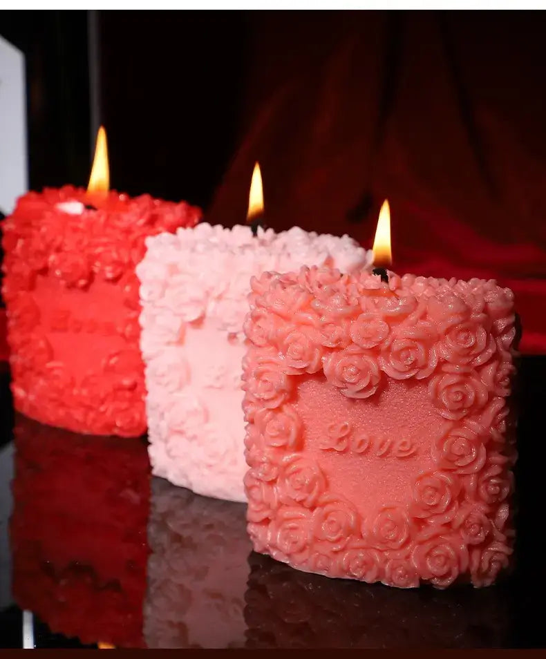 Colorful love-themed candles in red and pink, designed for sensual drips and massage to enhance intimacy.